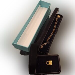 Tiffany 18k gold Padlock Bracelet with charm and additional padlock pendant.